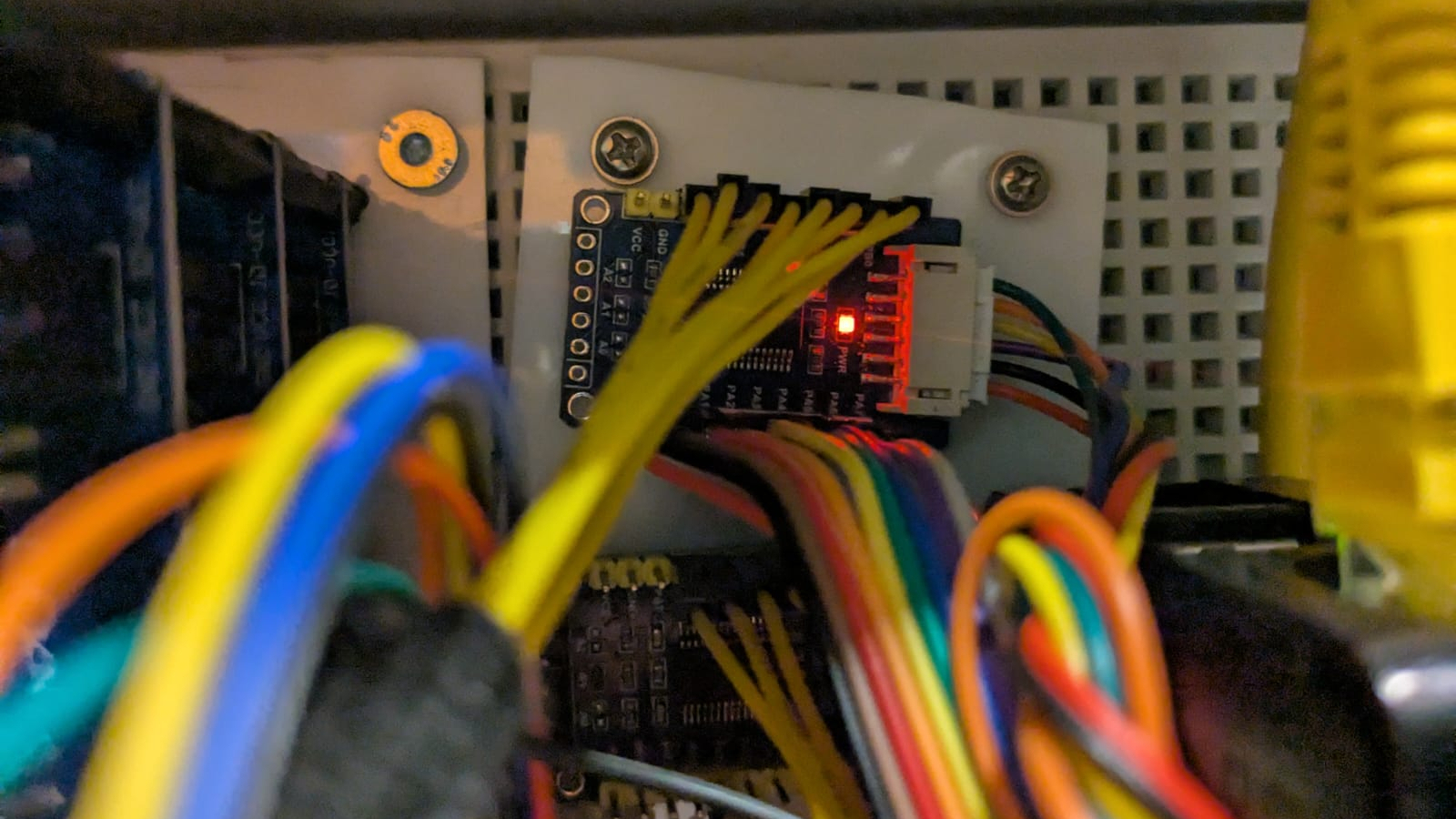 Raspberry Pi connected to four MCP23017 I/O expanders via I2C interface with wiring setup to control 32 electric locks